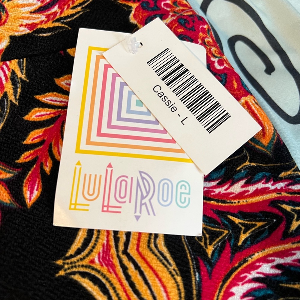 LuLaRoe Cassie Skirt with Red and Yellow Swirl Design